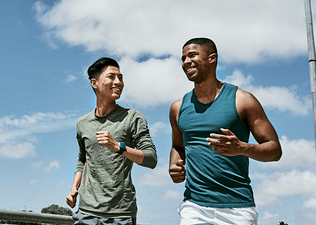 Two men jogging outside