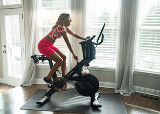 Woman on a Peloton Bike
