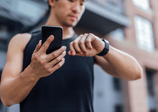 Person checking heart rate for heart rate training