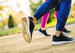 Feet of people running outside