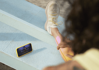 Peloton member stretching using the Peloton App