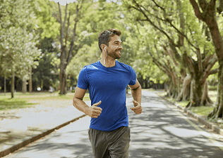 man running leisurely outdoors