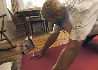 Peloton member doing a pilates class on the Peloton App