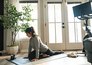 Woman doing yoga inside