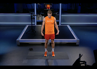 Man does calf raises as an ankle strengthening exercise