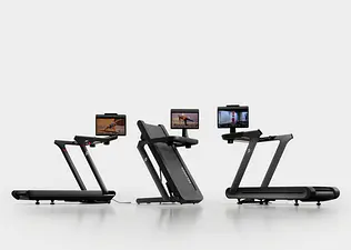 lineup of Peloton treadmills including the Peloton Tread Vision, folding Peloton Tread Flex, and slat-belt Peloton Tread+ Vision