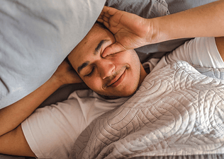 Man resting in bed