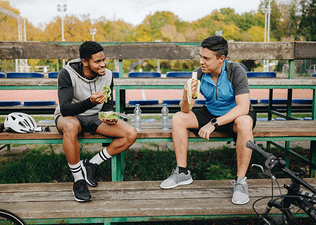 two people eating after a workout