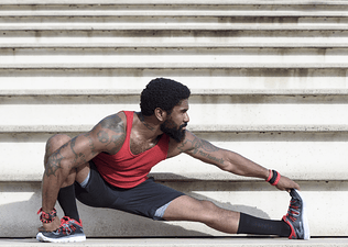 man stretching before a workout