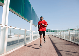 Man does a Fartlek run while running outside
