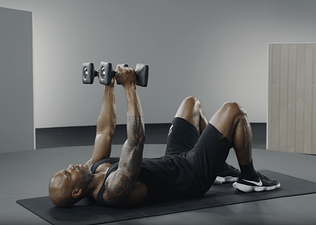 Adrian Williams demonstrates a skull crusher exercise 