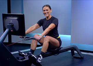 Katie Wang teaches a Peloton Row class, demonstrating proper rowing machine form