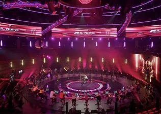 Peloton instructor Alex Toussaint teaches a cycling class at the 2025 Formula 1 Las Vegas Grand Prix