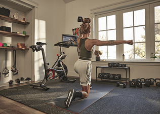 Woman does a strength training workout at home