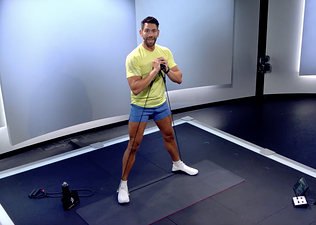 Matty Maggiacomo demonstrates a resistance band leg workout move in Peloton class 