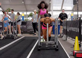 Peloton instructors Robin Arzón and Tunde Oyeneyin competing in HYROX.