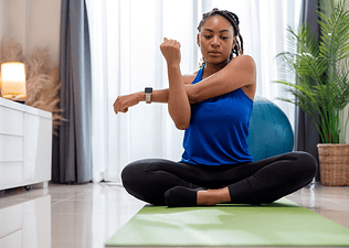 Woman doing a cross-body shoulder stretch