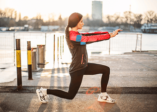 Woman does a lunge, a beginner leg exercise