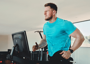 JJ Watt running with intensity on a Peloton Tread.
