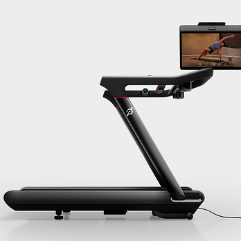 the Peloton Tread Vision treadmill with the screen swiveled to show a yoga class