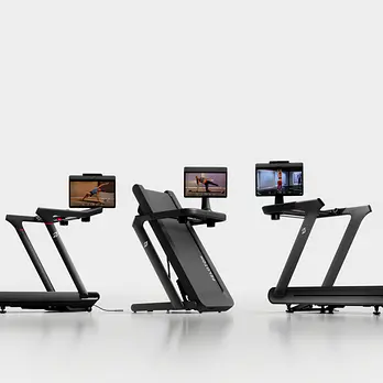 lineup of Peloton treadmills including the Peloton Tread Vision, folding Peloton Tread Flex, and slat-belt Peloton Tread+ Vision