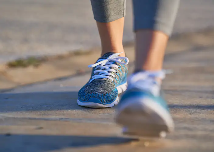 Closeup shot of sneakers walking