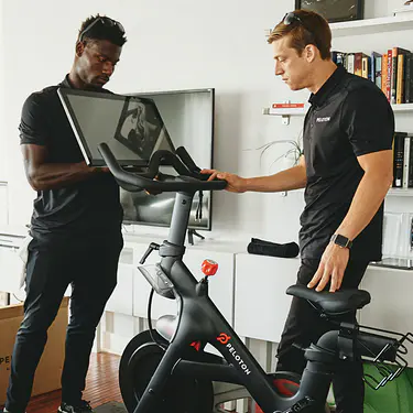 Peloton support staff in a members home