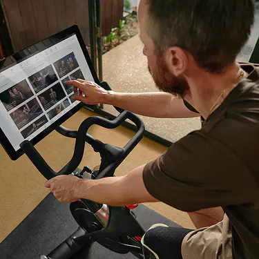 Man exercising on his Peloton Bike