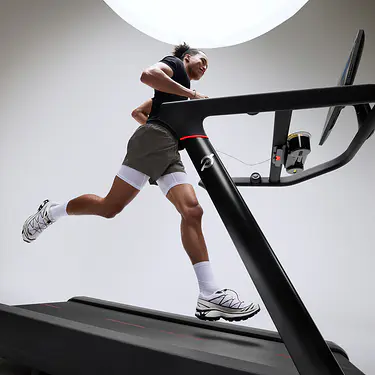 Man running on Peloton Tread