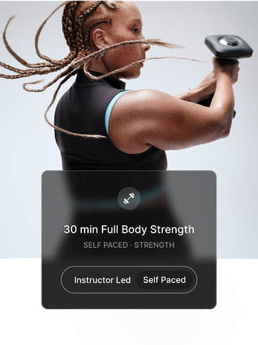 Close-up of a woman lifting a dumbbell in both hands. Overlay shows “30 min Full Body Strength,” with options for Instructor Led or Self-Paced.
