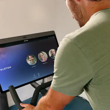 Man exercising on his Peloton Bike