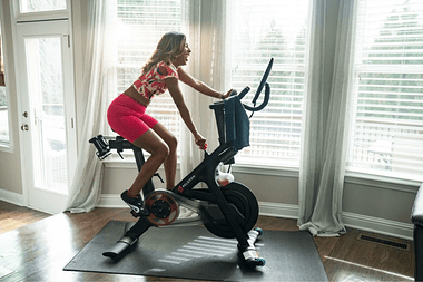 Lady working out on a Peloton Bike