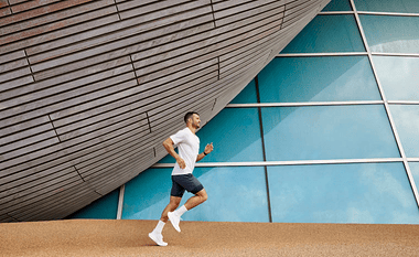 Man running near building