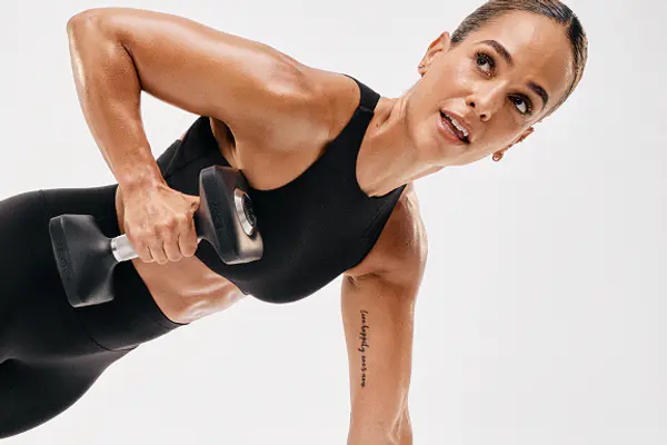 Peloton instructor lifting weight