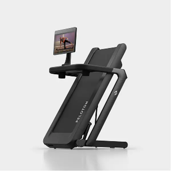 Peloton Tread Flex shown folded in an upright storage position with attached display screen.