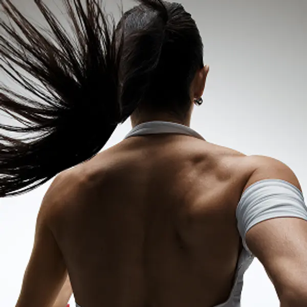 Photo of a woman running from behind