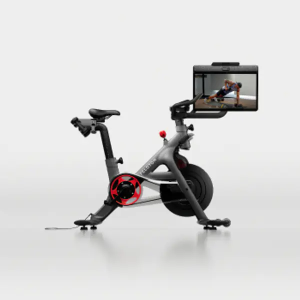 Peloton Bike plus with a large touchscreen display in a studio setting