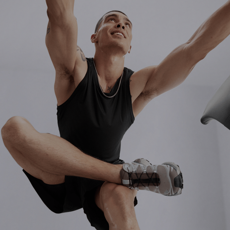 Man exercising using Peloton equipment