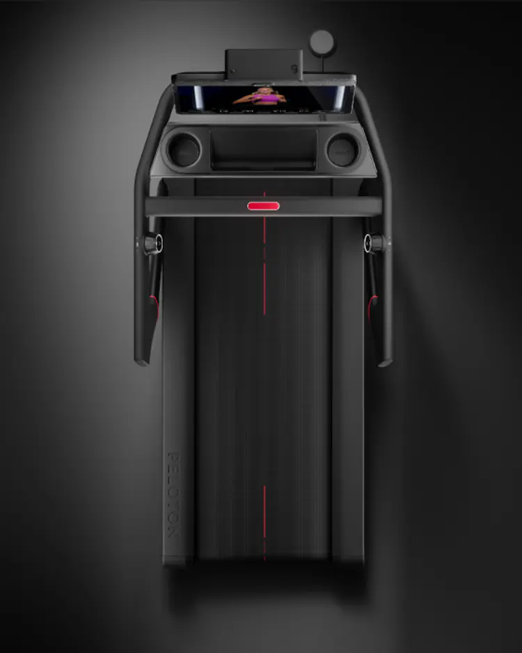 Side view of a Peloton Tread treadmill with an inset card showing running efficiency stats.