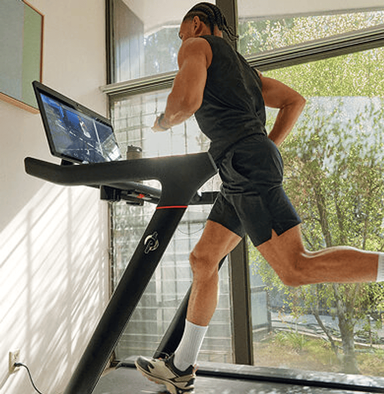A man running on a Peloton Tread