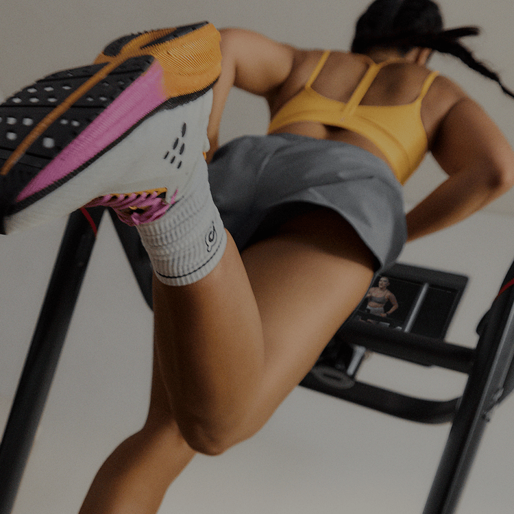 Woman running on Peloton Tread