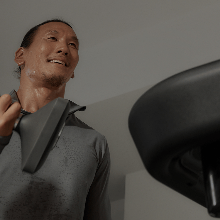 Peloton member lifting weights