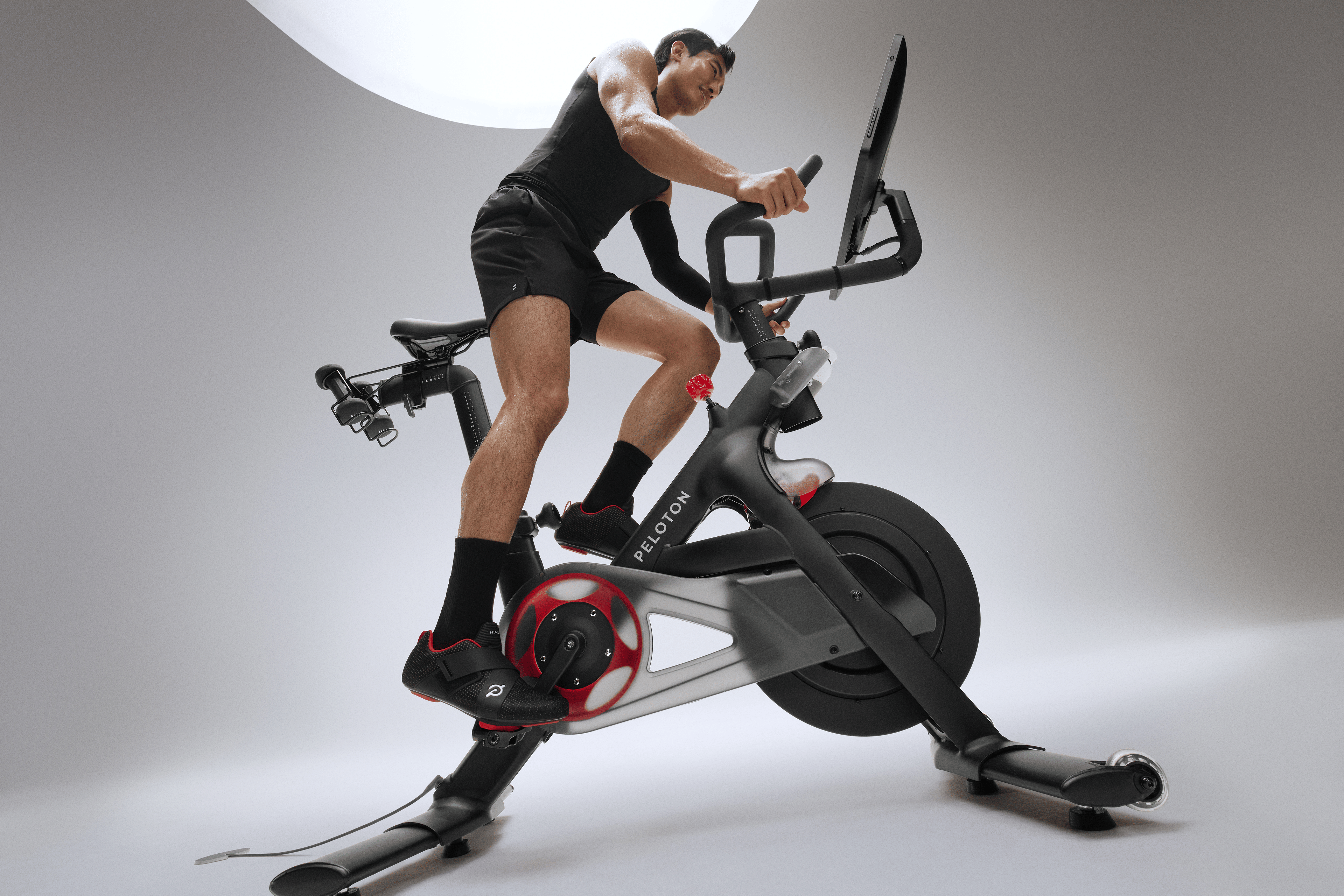 Man cycling in the sweet spot on a Peloton Cross Training Bike.