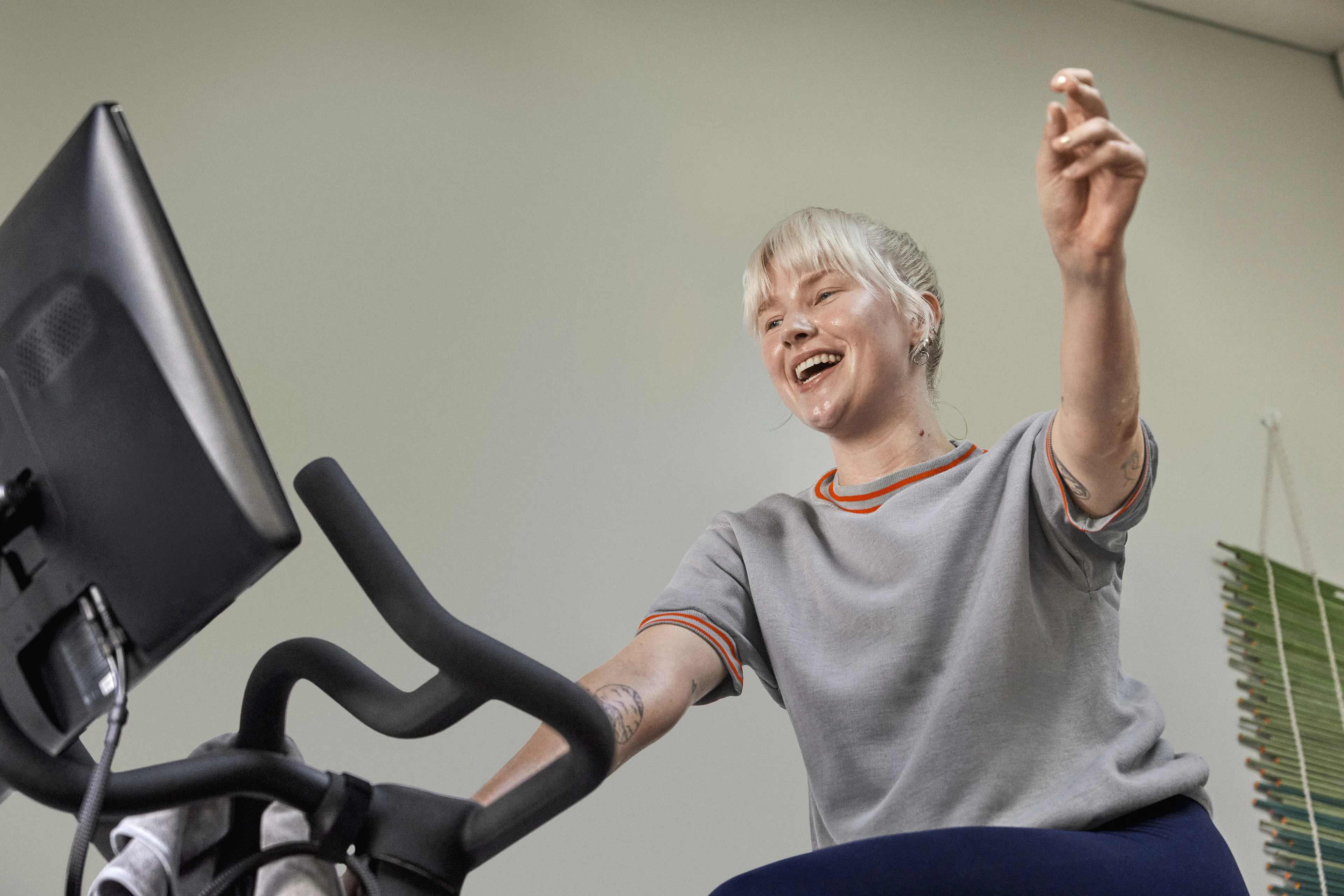 Woman cycles on a Peloton Bike