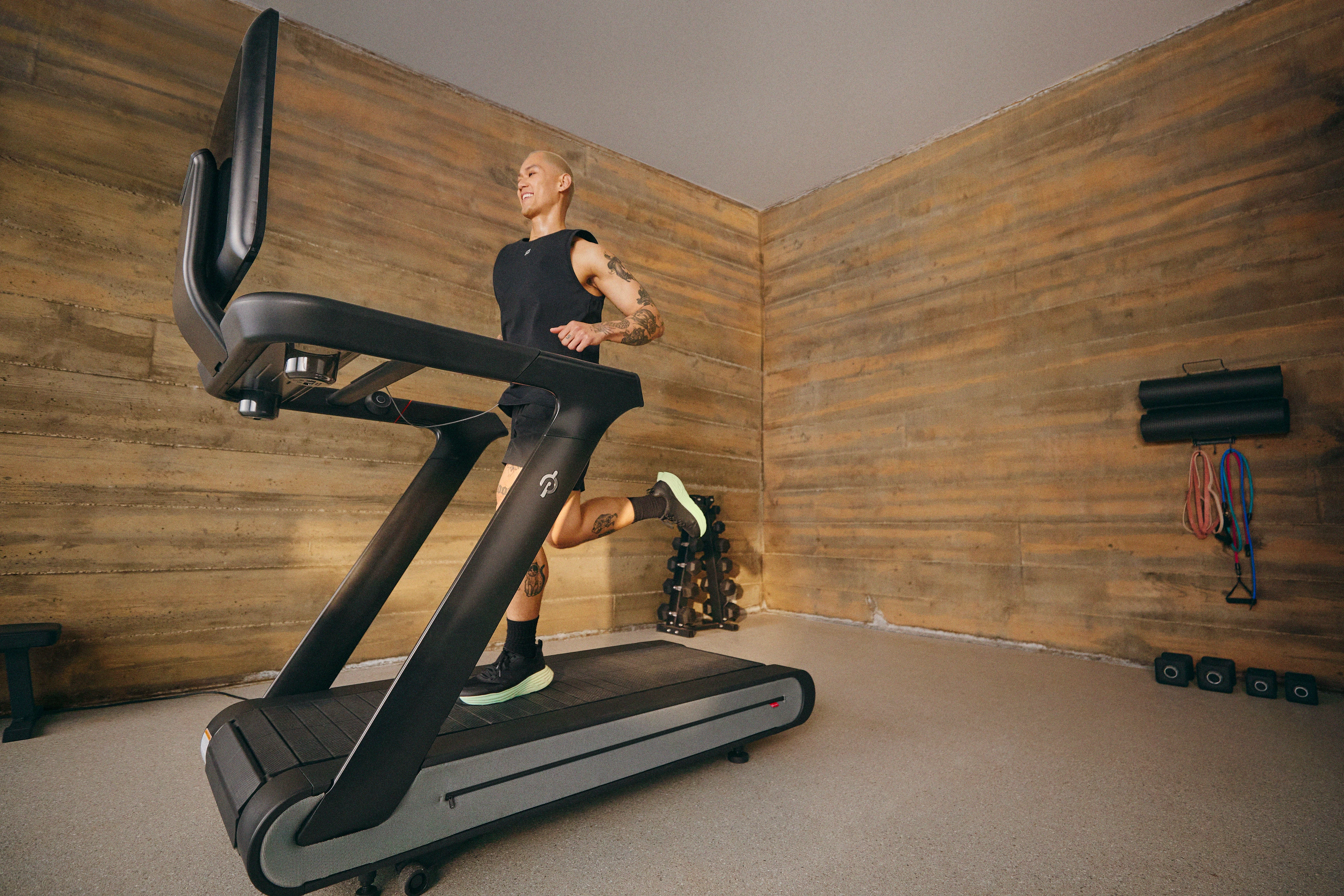 Man running on a Peloton Tread+ wondering about the differences between running on a treadmill vs outside.