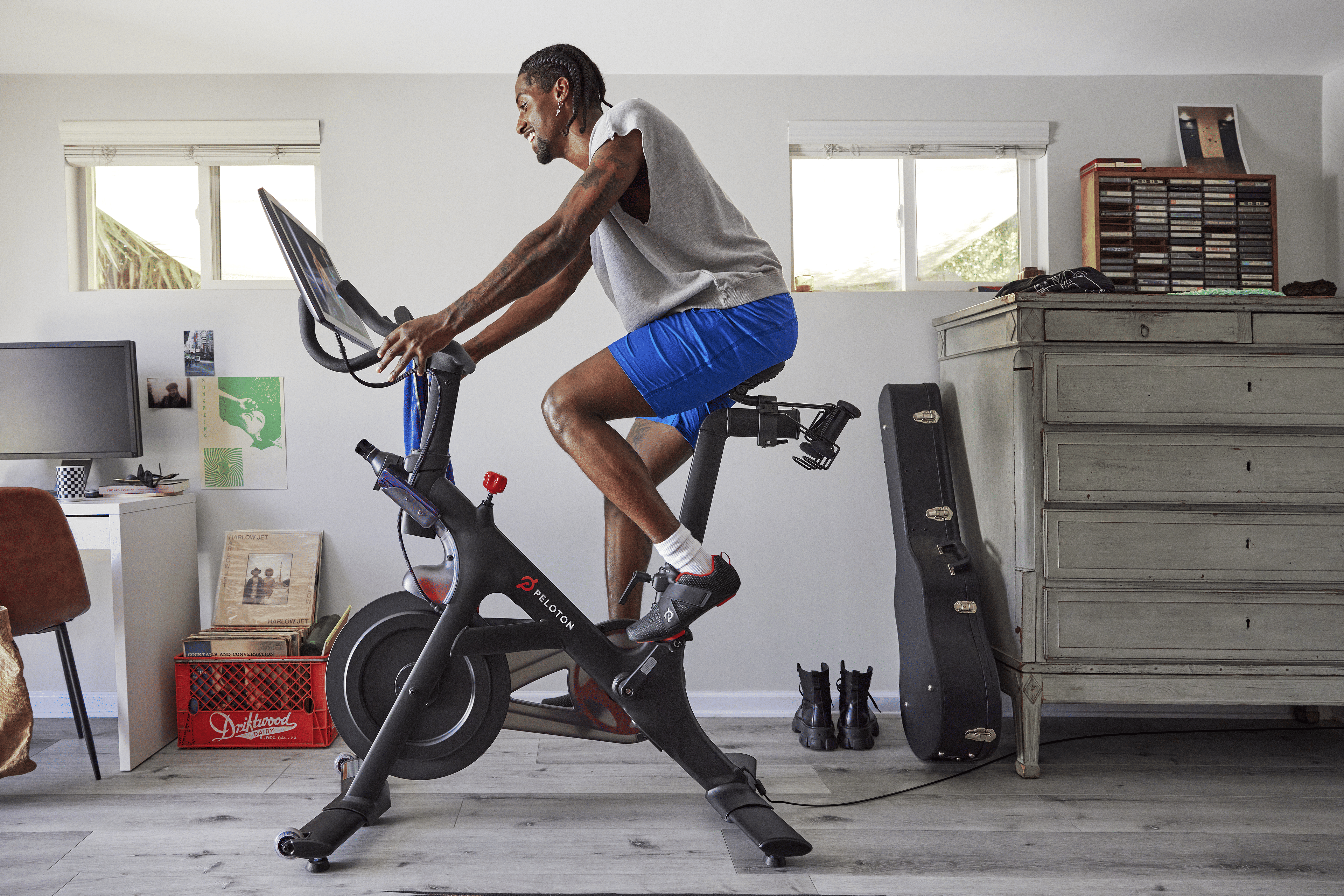 Man riding Peloton on Bike