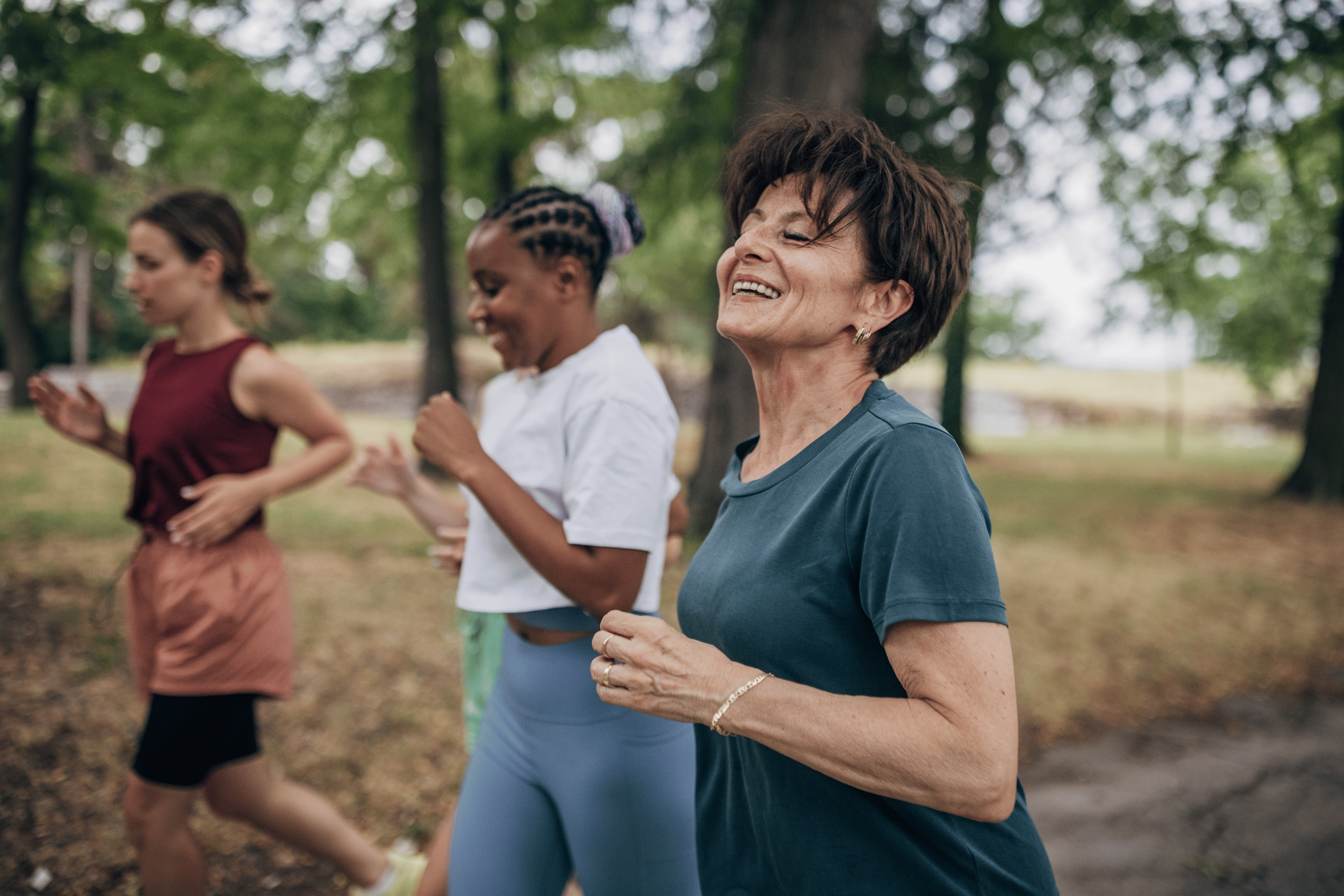 Woman running with a group as part of her exercise routine during menopause.