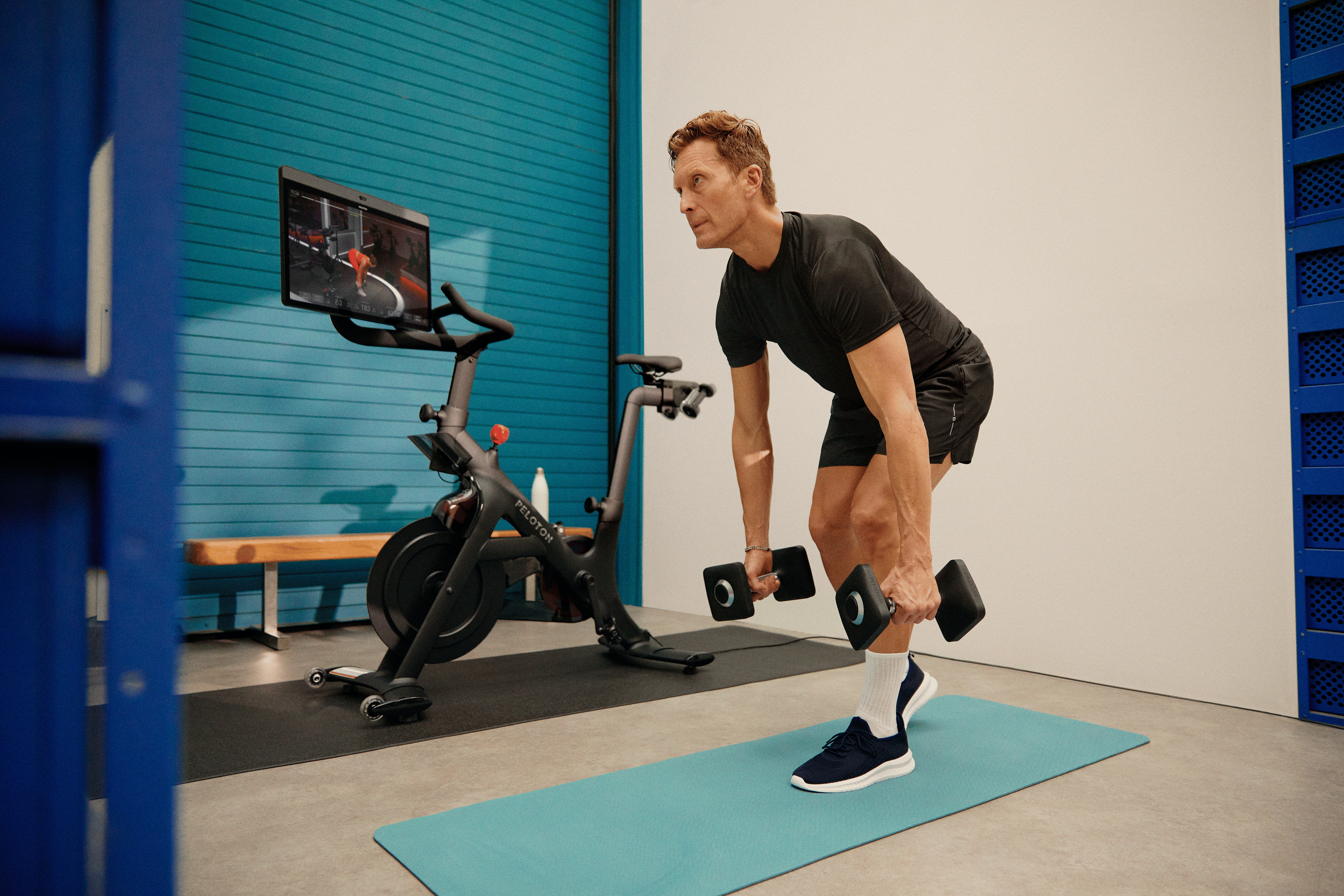 Man doing a Peloton Bike Bootcamp class as part of his weekly workout routine.