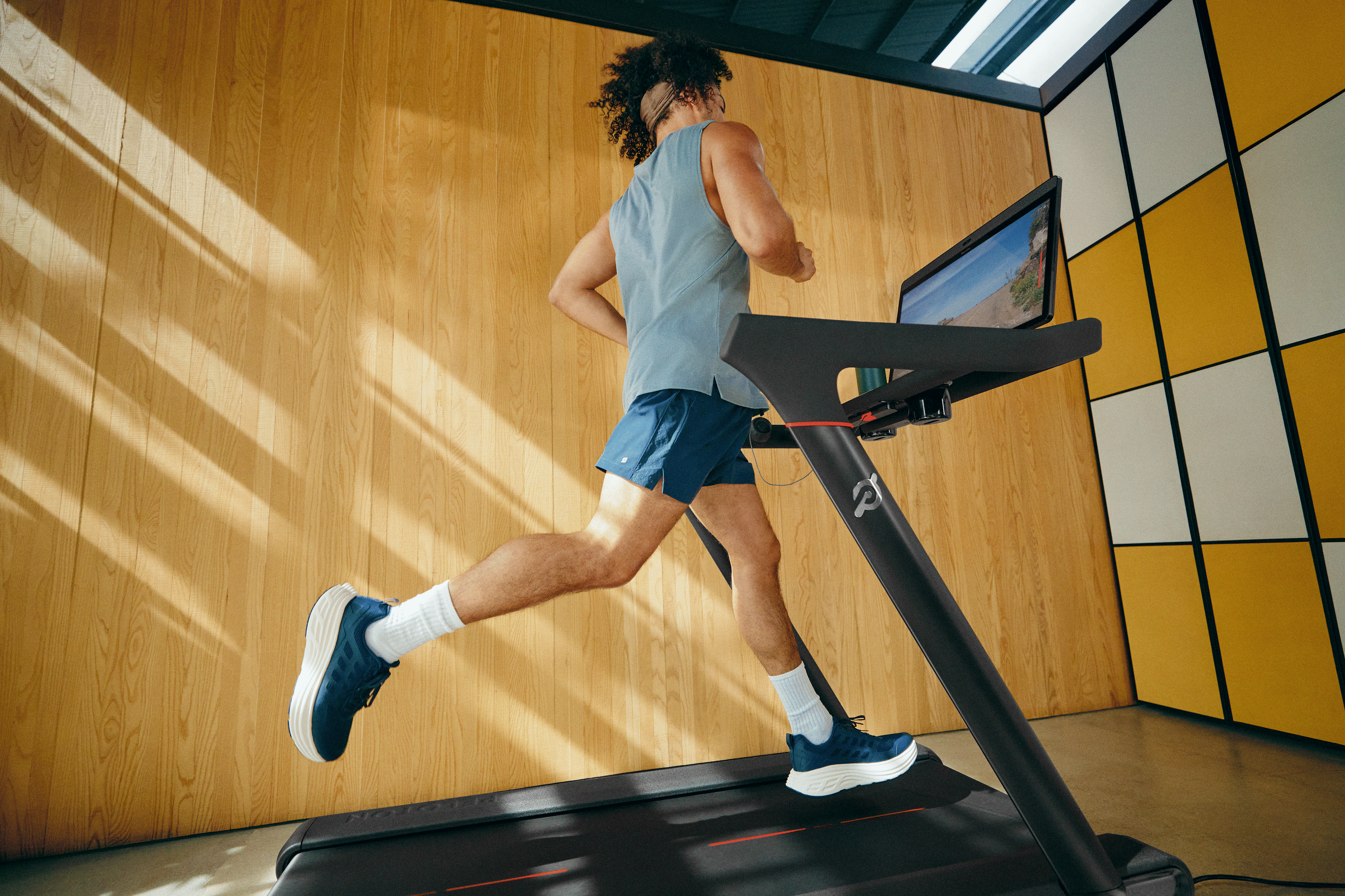 Beginner runner learning how to start running on a Peloton Tread 