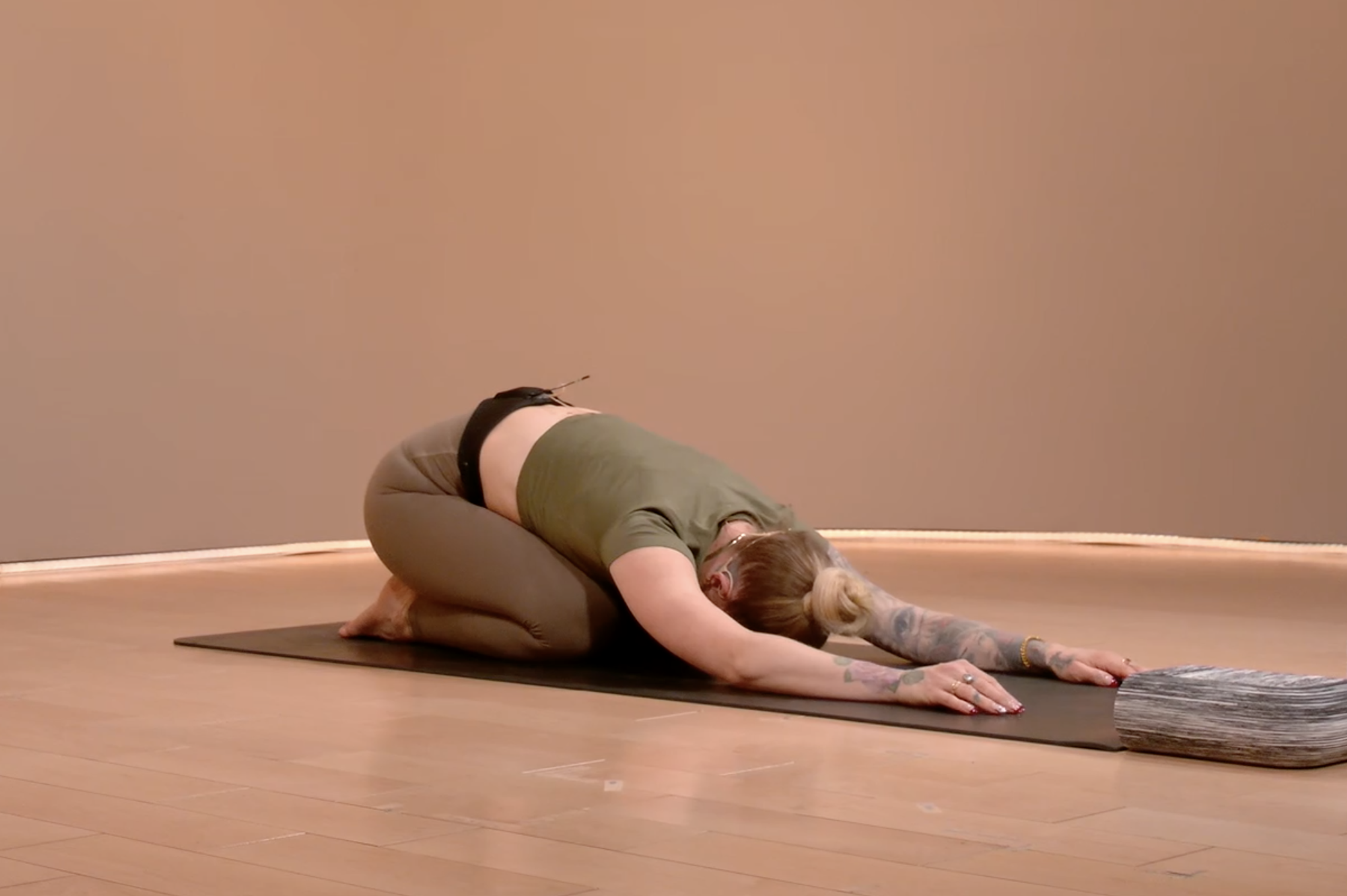 Woman practices Child's Pose in yoga